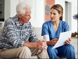Nurse speaking with a patient about Medicare.