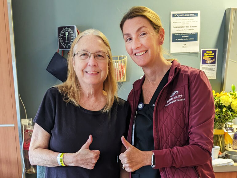 Cindy Mohrmann smiling with therapist 