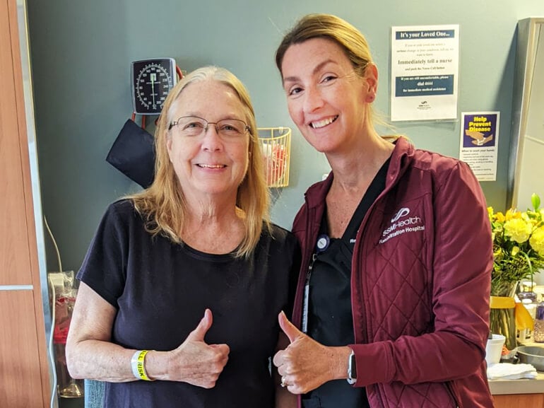 Cindy Mohrmann smiling with therapist