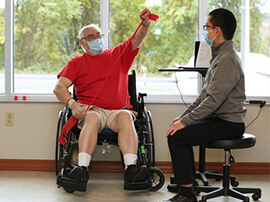 orthopedic rehabilitation therapist working with a patient