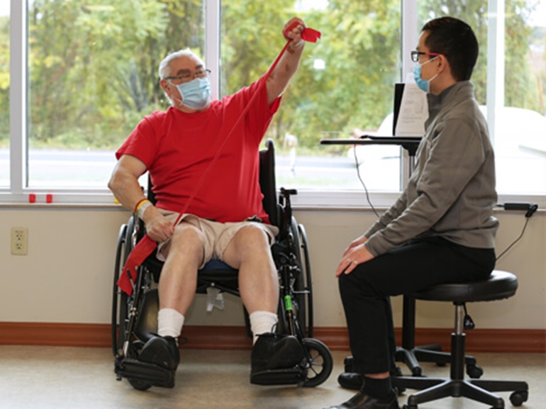 orthopedic rehabilitation therapist working with a patient