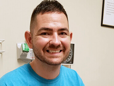 Patient Ben Jurs smiles for the camera.