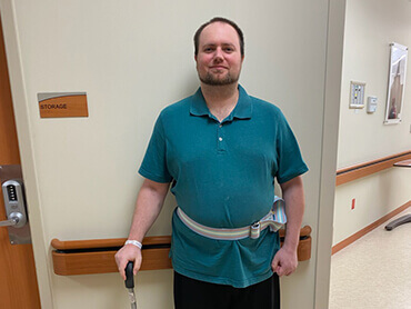 Stroke patient Tyler Wibbenmeyer, smiling.