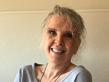 Patient Melissa Herrmann smiling.