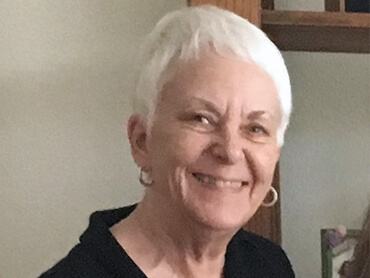 Patient Sharyn Jacobsen smiling.
